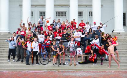 group of club sport participants posing on the front steps of the Reckord Armory