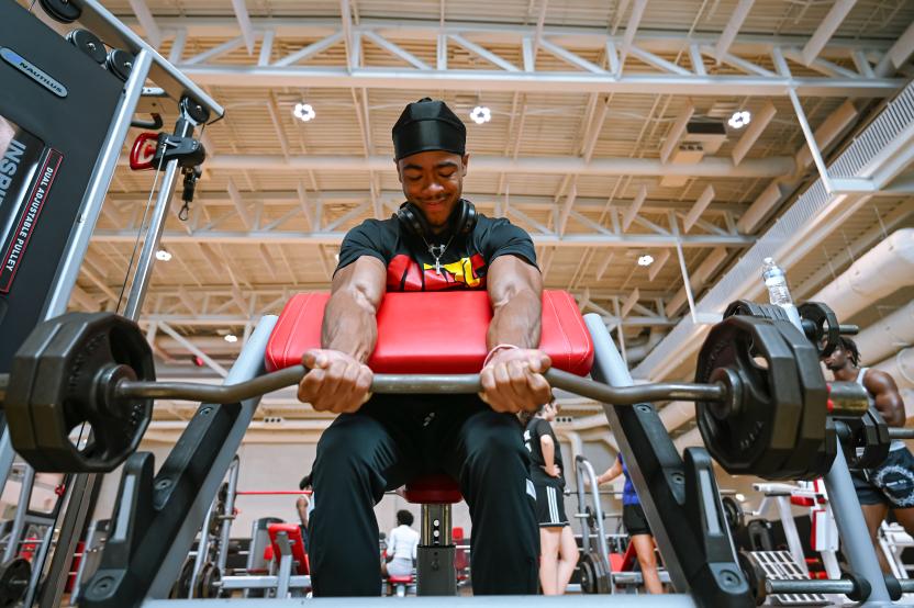 man lifting weights