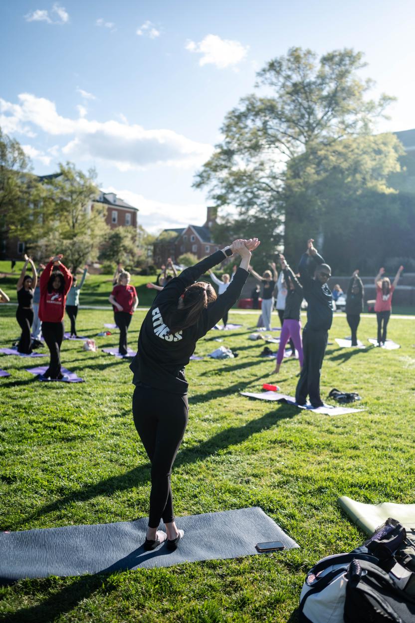 Outdoor yoga class stretching