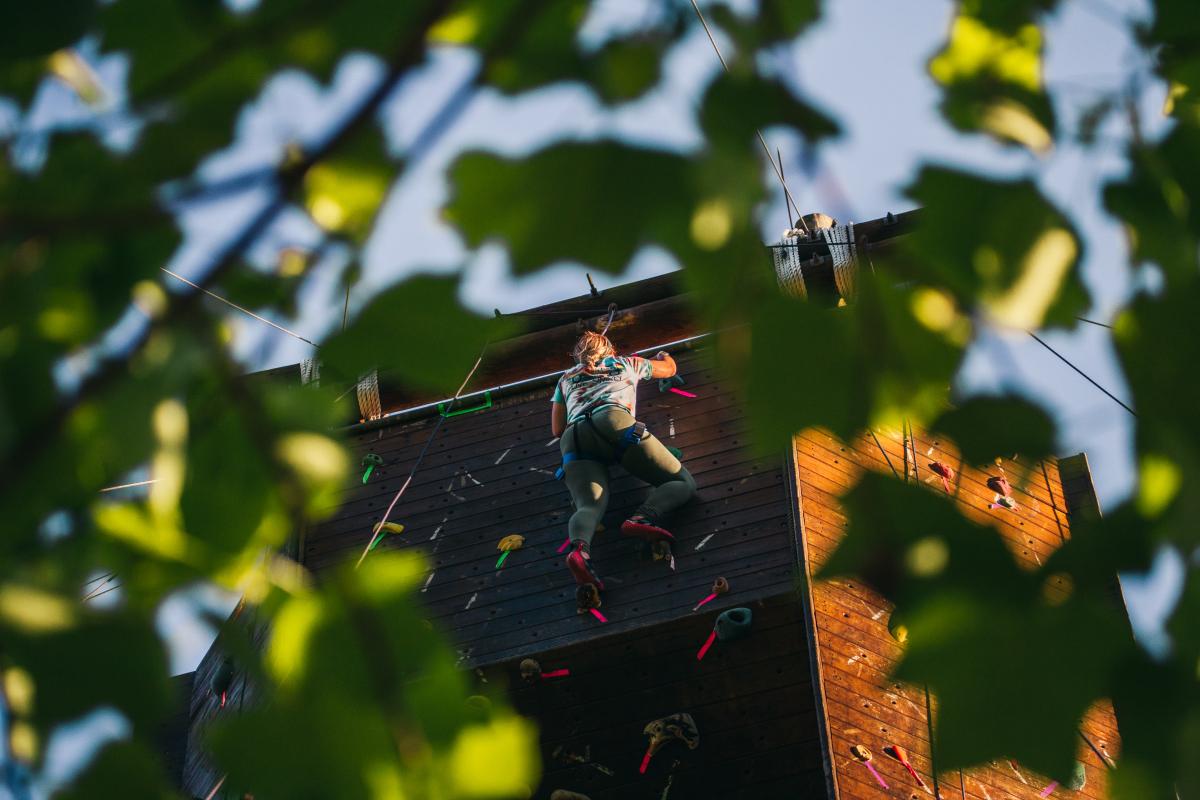 woman rock climbing outdoors
