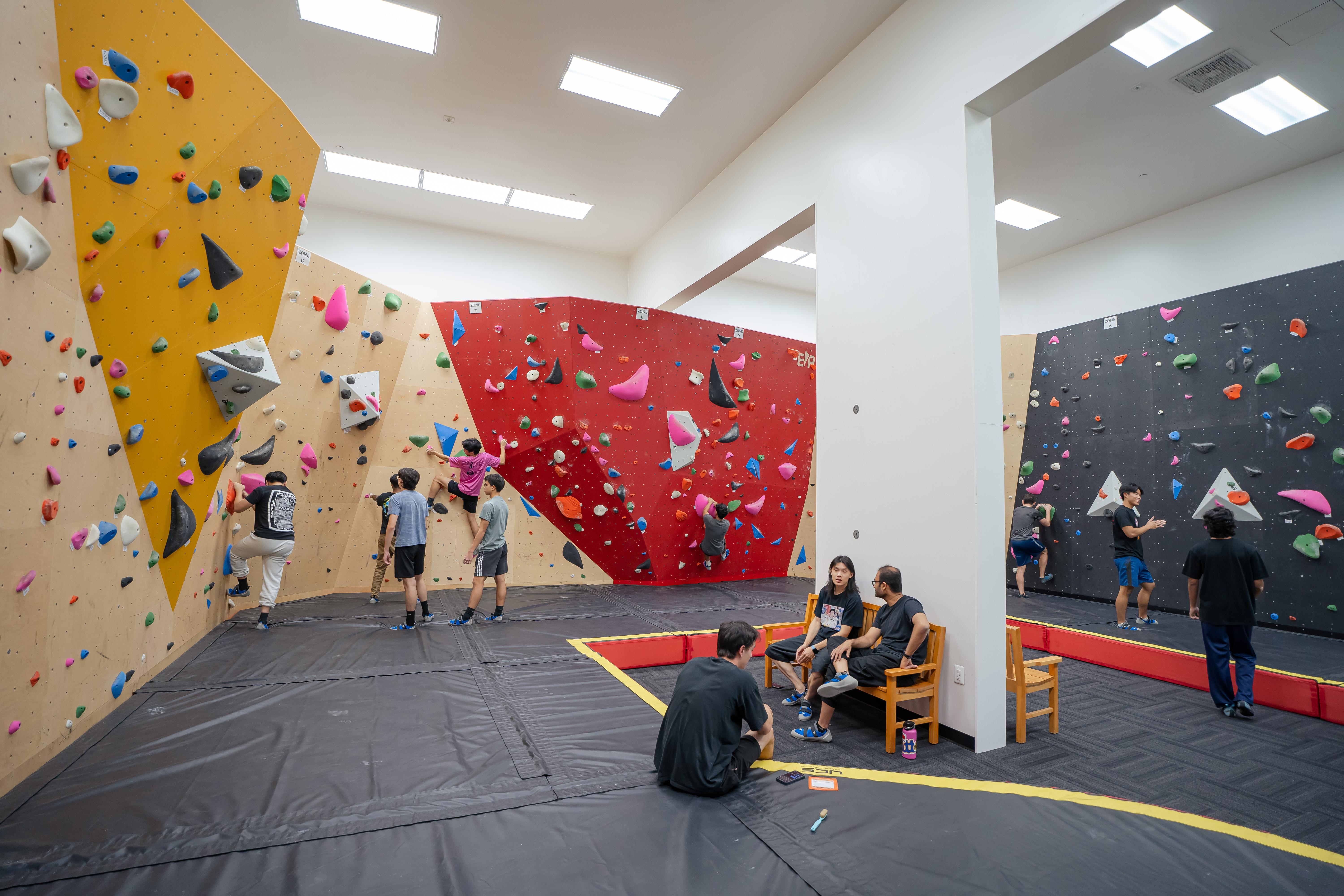men climbing in bouldering zone