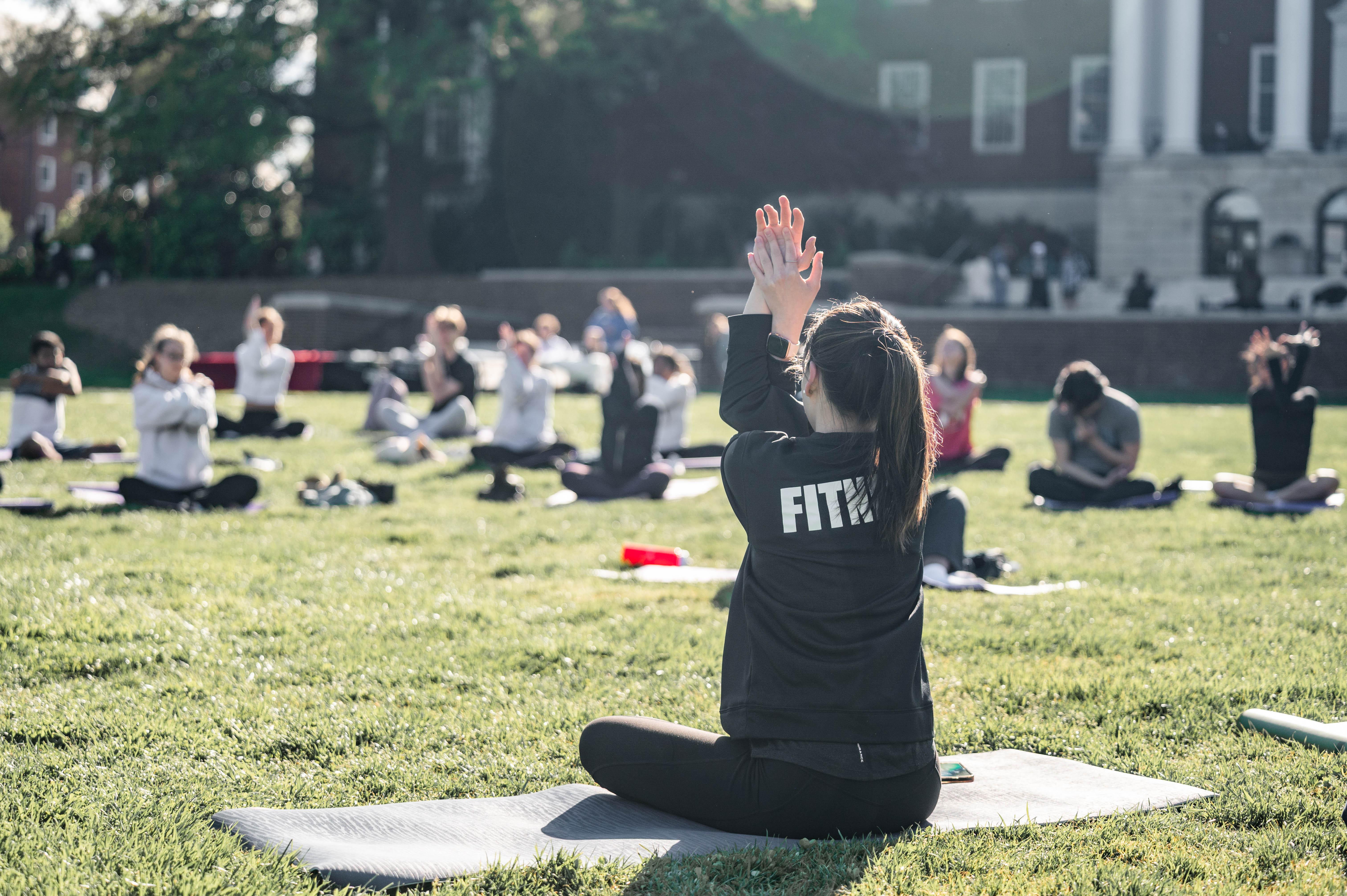 woman doing yoga pose stretching forearms