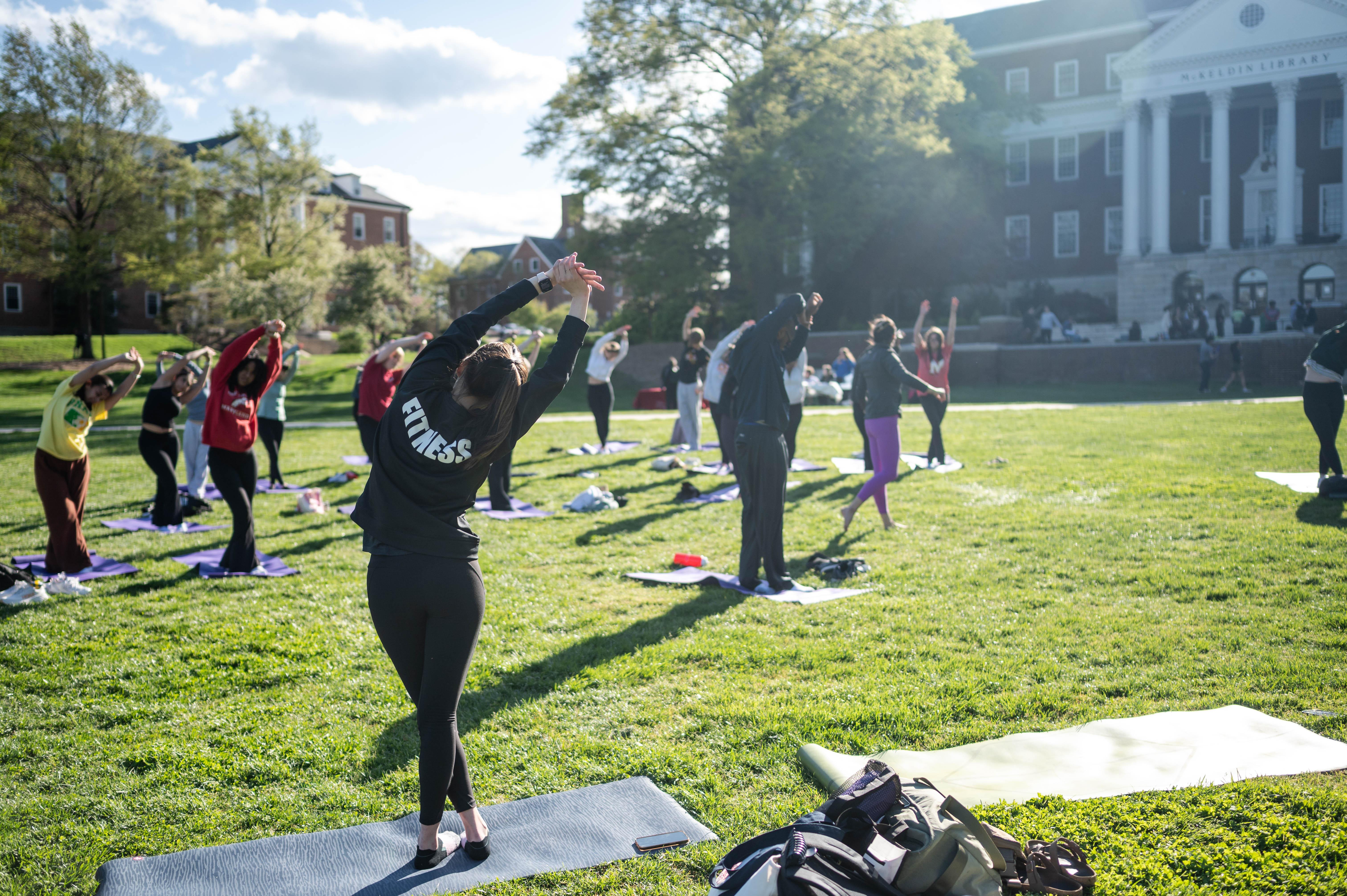 yoga class outdoor on a sunny day in McKeldin Mall