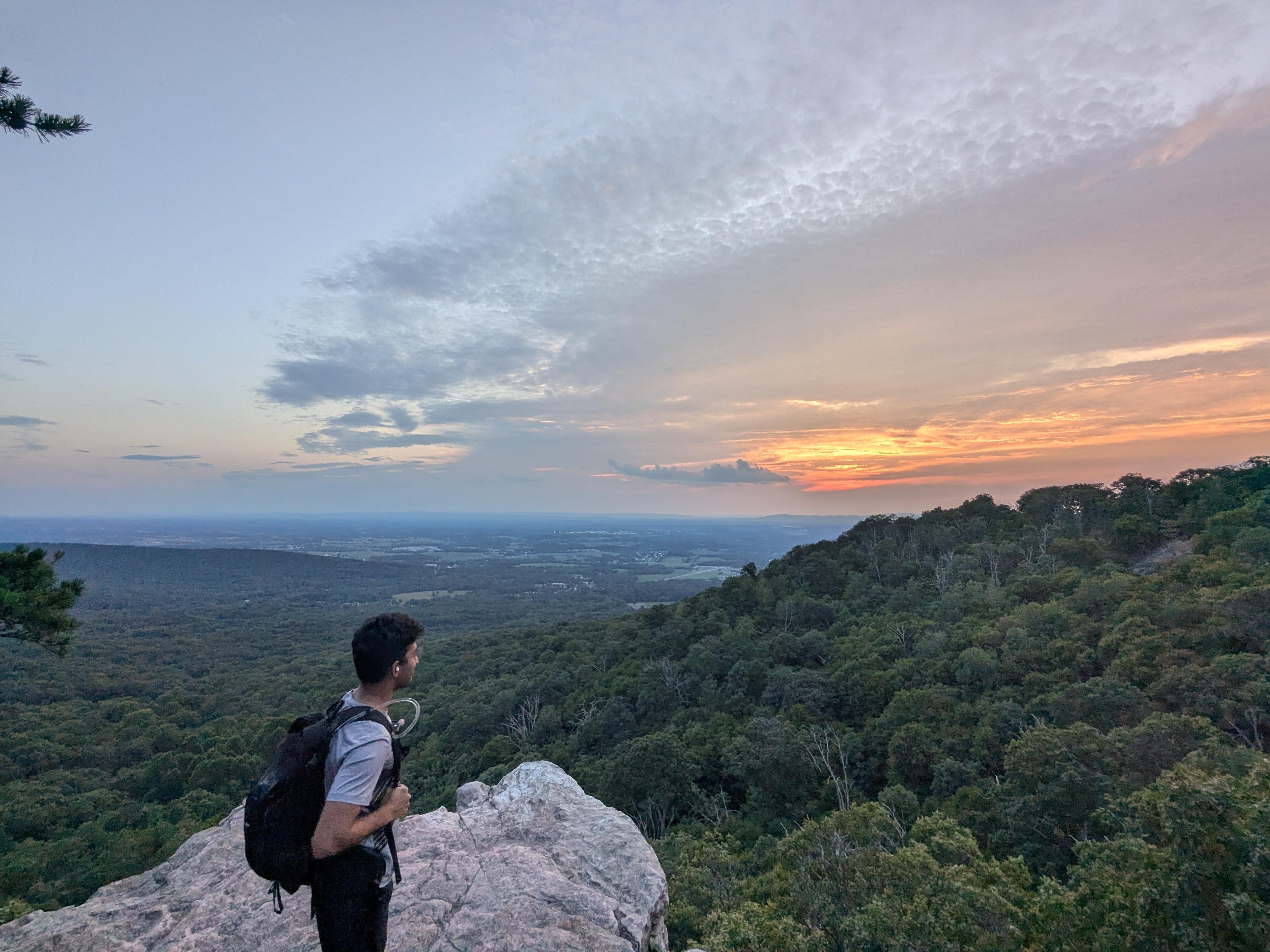 Man hiking at a peak mountain in maryland